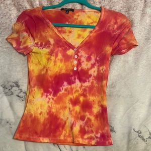 pink, orange, and yellow tie-dye shirt
